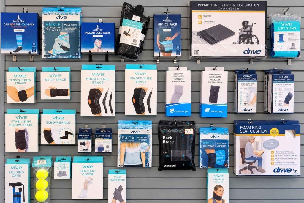 ACi Medical Supplies display of brace and cold pack products on store shelf