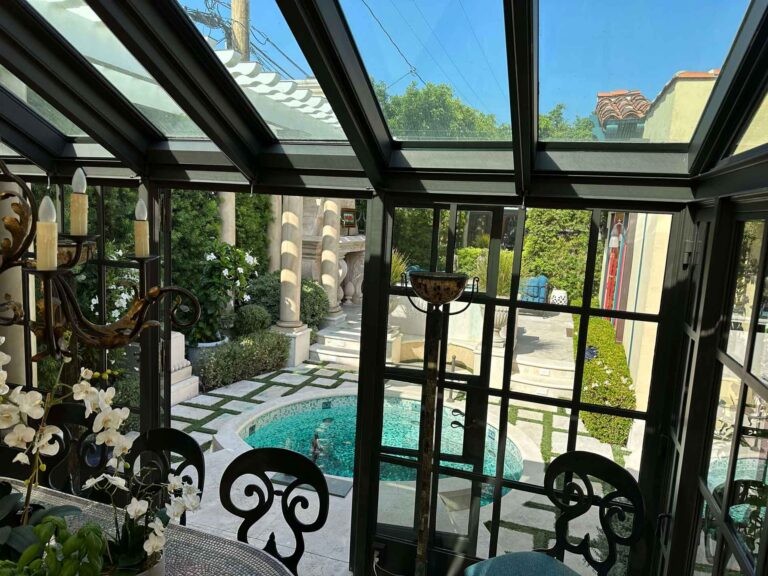 Callender's House Of Glass outdoor pool patio with glass roof and windows
