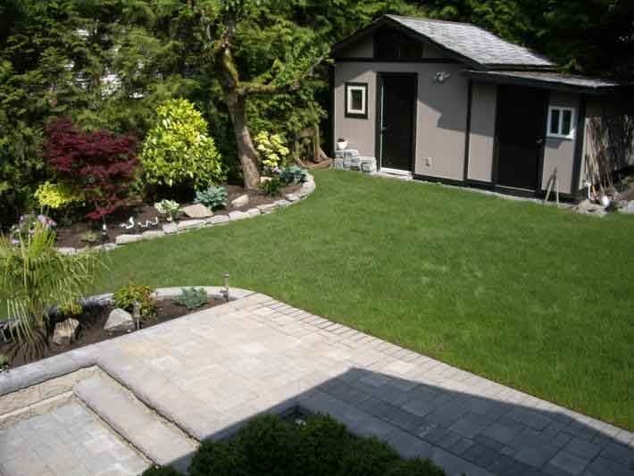 Oasis West Land Design landscape with lush garden, stone walkway, and modern garden shed