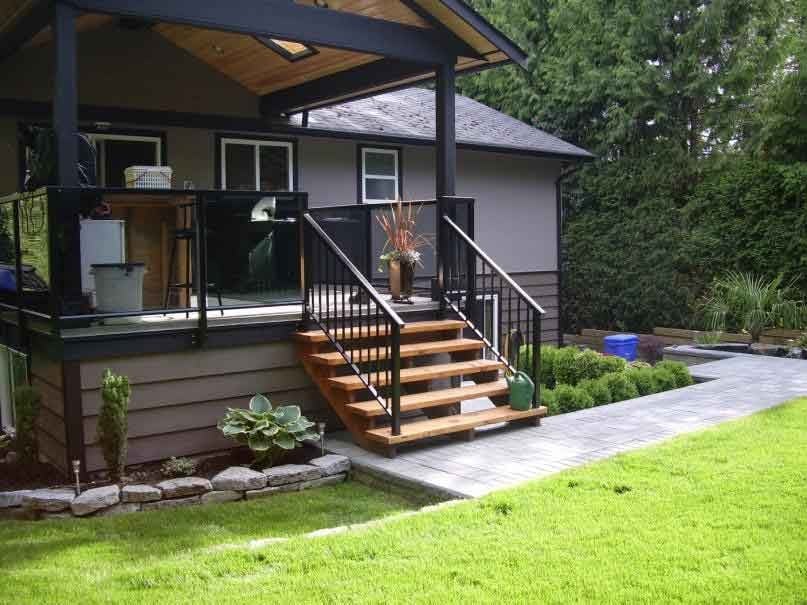 Oasis West Land Design backyard landscape with stone walkway, steps, and lush greenery
