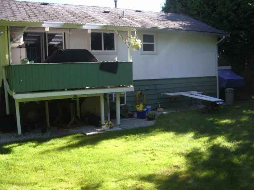 Oasis West Land Design backyard landscape with patio and green fence