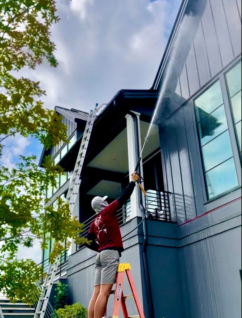 A pressure washing service image in Charleston, possibly a house facade or building exterior after cleaning