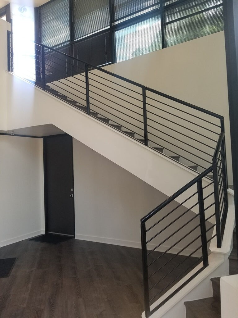 Protractor Roofing building railing on an indoor stairway