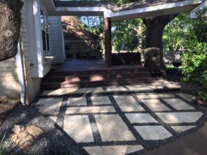 Protractor Roofing team installing new roof shingles on a home exterior