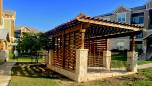 Protractor Roofing installing a custom wood pergola cover on a residential property
