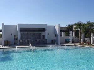 Protractor Roofing building exterior with swimming pool and modern structure