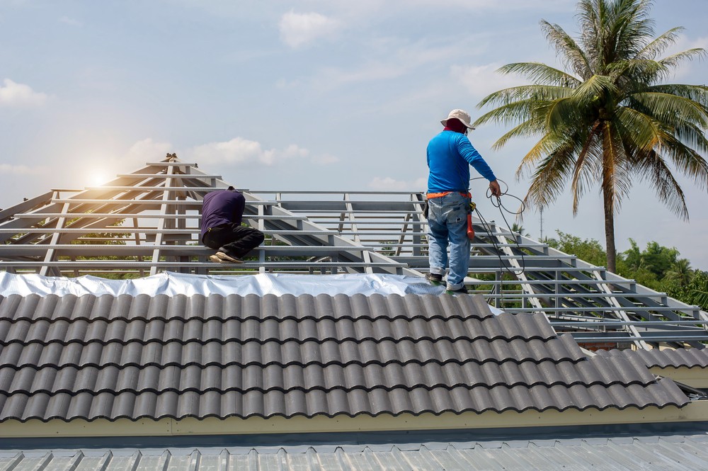 Worker installing Clay Tile Roofs