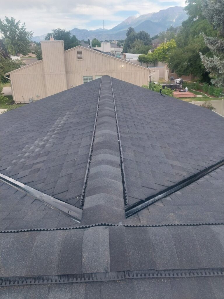 A+ Roofing Services installation of a new asphalt shingle roof with ridge vent on a home