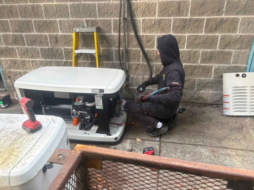 Excalibur Electric Ltd electrician servicing an electrical generator on site